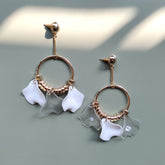 White leather women's earrings-clear with distinctive petal-link metal ring